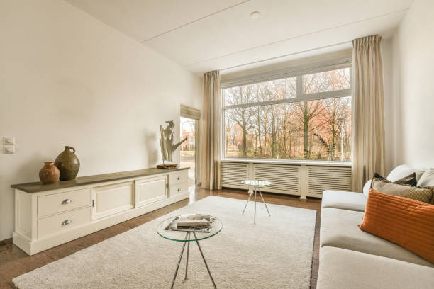 istock a living room with a couch and a large window 1464500241