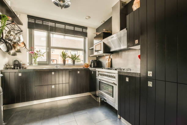 istock a black kitchen with stainless steel appliances and black cabinets 1464501246