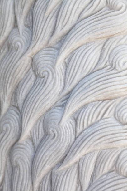 istock Animal fur curly waves pattern carved in stone close-up 1464503700