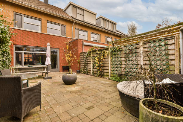 istock a patio with a seating area and a privacy fence 1464504014