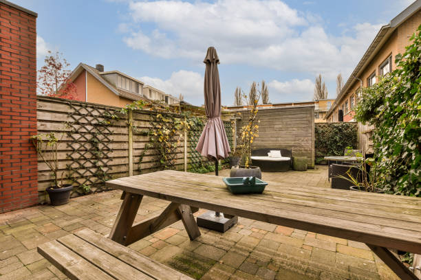 istock a backyard with a picnic table and a table umbrella 1464504310