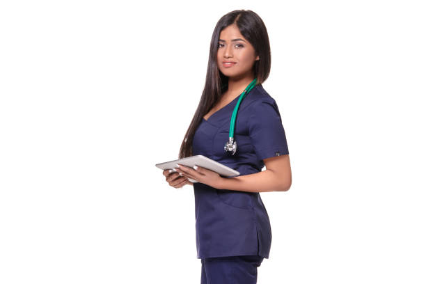 Young pretty doctor with a stethoscope and a medical history in her arms stock photo