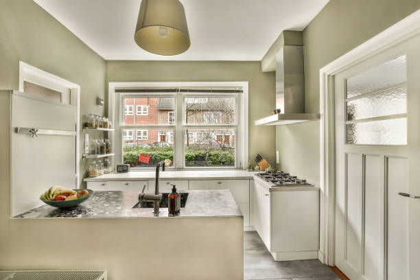 istock a white kitchen with a large window and a sink 1464504505