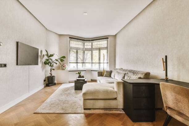 istock a living room with a couch and a desk 1464505063