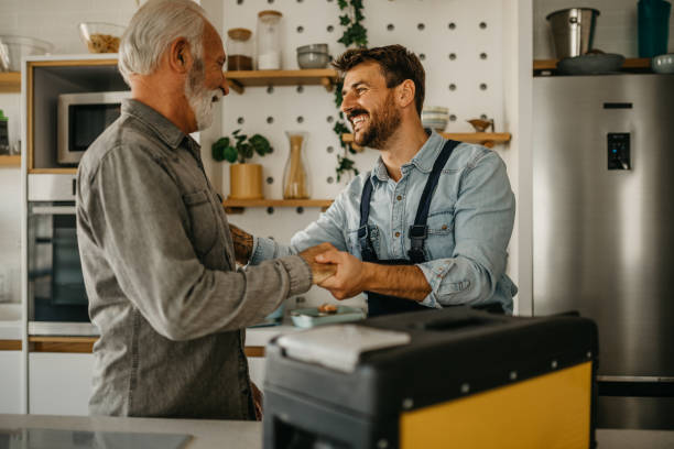 istock Handshaking repairman 1464505073