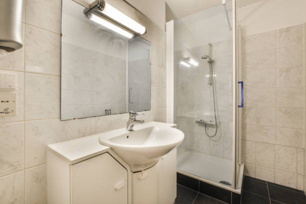istock a small bathroom with a sink and a shower 1464505108