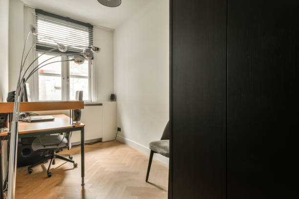 istock a home office with a desk and a window 1464507408