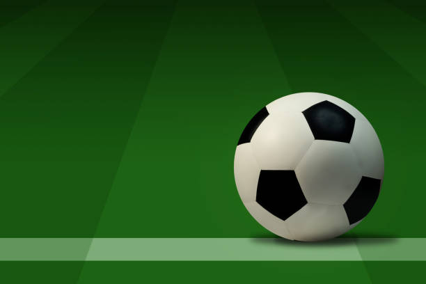 istock Soccer ball on green grass with copy space for text. 1464507482