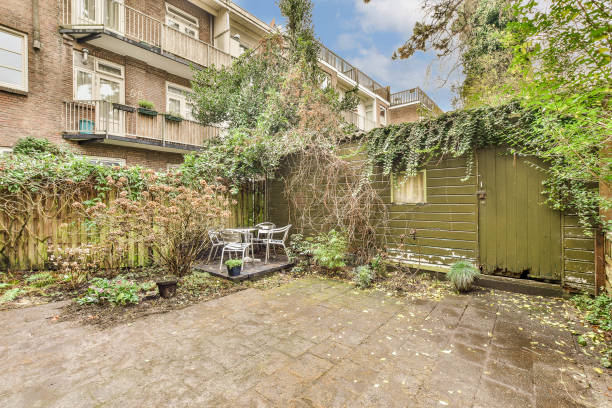 istock the backyard has a patio and a green garage door 1464507847