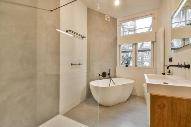 istock a white bathroom with a tub and a shower 1464508239