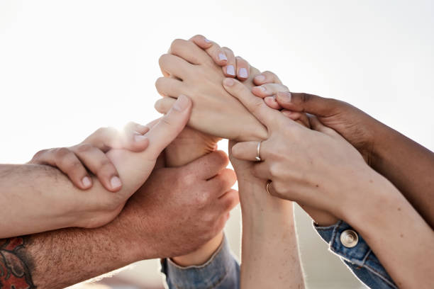 istock Hands, connection and people with support in city for love, collaboration and multiracial community. Team building, outdoor and hand of group for trust, solidarity and diversity empowerment in town. 1464509541