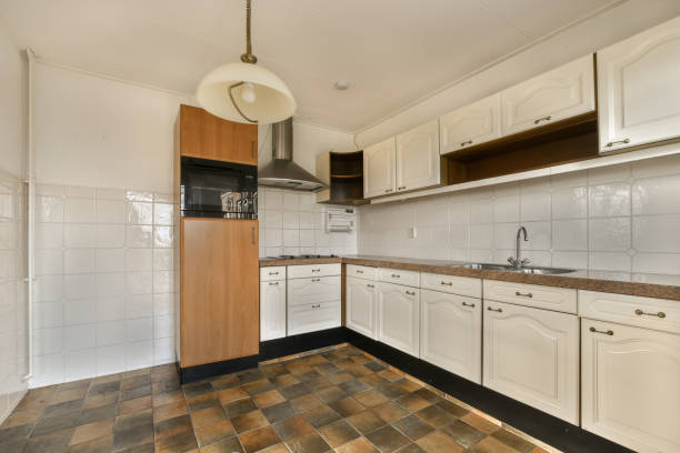 istock a kitchen with white cabinets and a counter top 1464510330