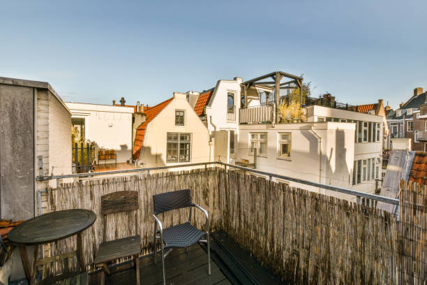 istock a balcony with a table and chairs and a building 1464512292