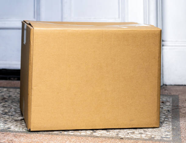 istock Cardboard box home delivery close up 1464512506