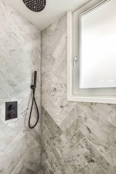 istock a bathroom with a shower and a window in it 1464512782