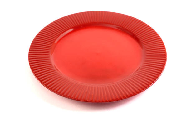 istock Empty and Clean Red Plate Isolated on a White Background 1464514350