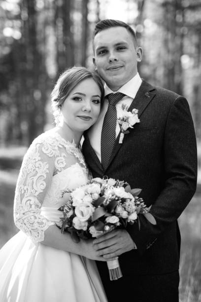 istock the bride and groom are walking in a pine forest 1464514752