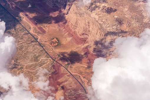 8/27/2022:  Southwest USA - Aerial view of clouds over a highway in the desert
