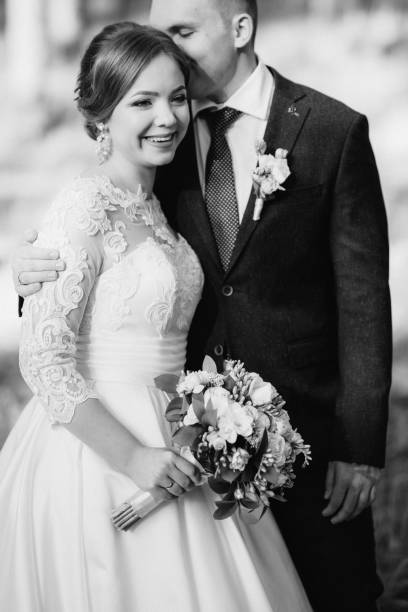 istock the bride and groom are walking in a pine forest 1464517905