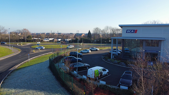 Aerial View of Huge and Big Car Parking of Local Car Sales Auctions at Kempston Bedford Town of England United Kingdom. Aerial Footage was Captured on 06 Feb 2023 with Drone's Camera on a Sunny Day