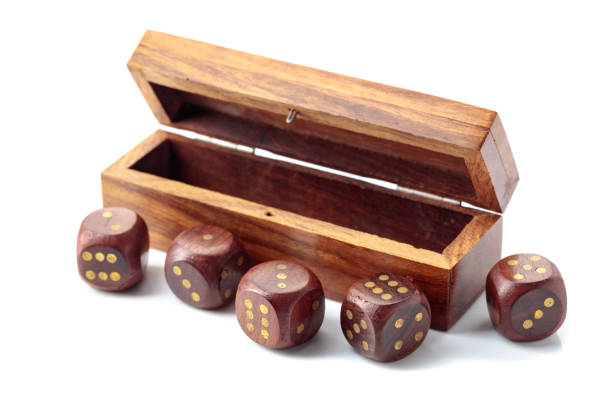 istock The old wooden dice isolated on a white background. 1464525278