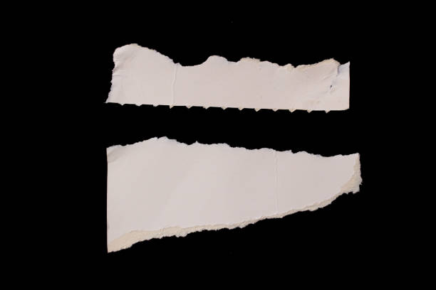 istock Torn paper piece isolated on black background 1464526956