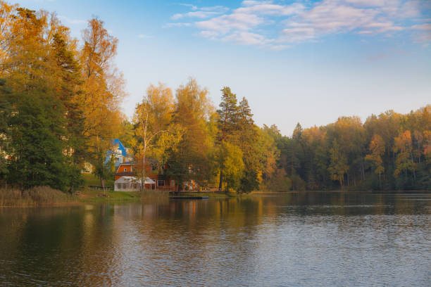 istock Cottages by the lake, fall season. 1464527617