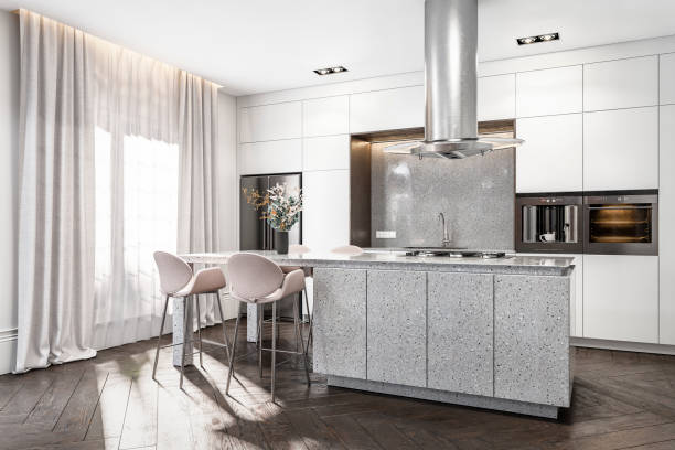 istock Side view of a classic elegant interior - a modern kitchen with a french style antique wall background, kitchen island, and stools, windows with curtains 1464527736