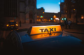 Taxi cab sign stand service at night city