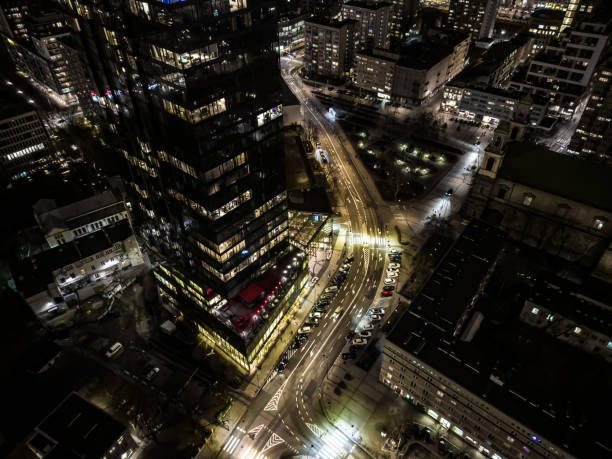 istock Office building still operate at very late night with many office worker doing part time work. Salary man overworking issue concept in urban of countries and urban night skyline. 1464534774