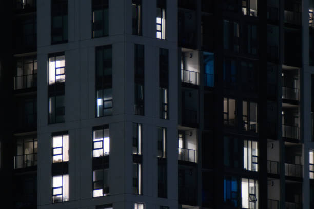 istock Facade of Apartment Building at Night 1464535550