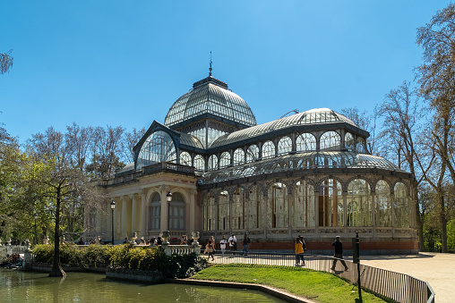 The Crystal Palace is a metal and glass structure located in the Retiro Park in Madrid (Spain).\nIt was built by Ricardo Velázquez Bosco, and its construction project was inspired by the Crystal Palace, built in London in 1851 by Joseph Paxton. In London the Crystal Palace had been erected in Hyde Park in the context of the Exhibition of Industrial Works, and in Spain the Crystal Palace was built in 1887 for the Exhibition of the Philippine Islands.