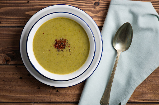 Broccoli soup on table.