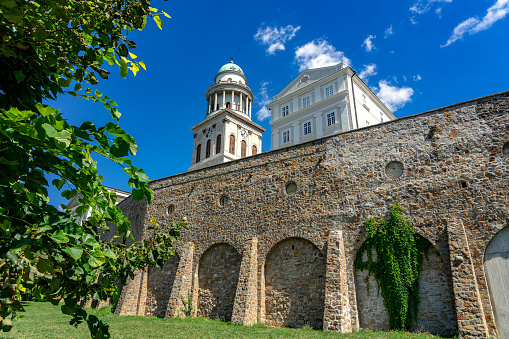 Pannonhalma arch abbey with nice summer sky in Hungary .