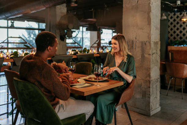istock Happy couple in restaurant for Valentines day. 1464538043