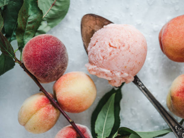 Homemade ice cream and ripe, juicy peaches