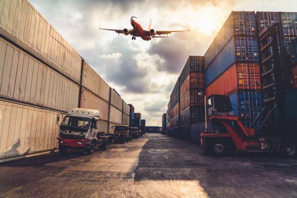 istock Cargo container for overseas shipping in shipyard with airplane in the sky . Logistics supply chain management and international goods export concept . 1464539137