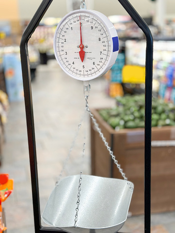 Weight scale and groceries in supermarket