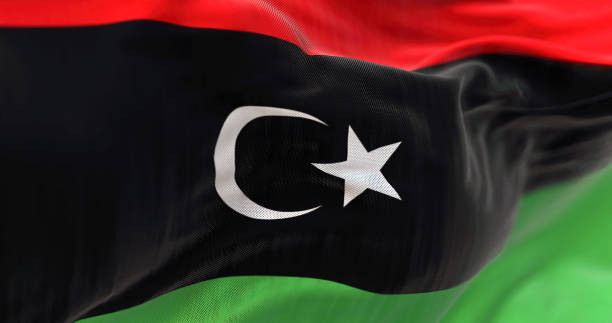 detail der libyschen nationalflagge flattert - libya flag libyan flag three dimensional shape stock-fotos und bilder