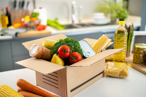 istock Open food deliver box on kitchen counter 1464543177