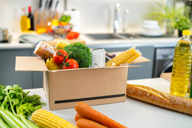 istock Open food deliver box on kitchen counter 1464543281