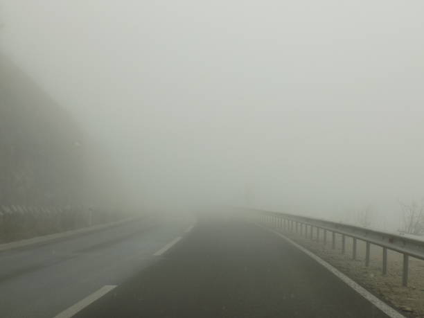 istock thick FOG on the highway 1464543758