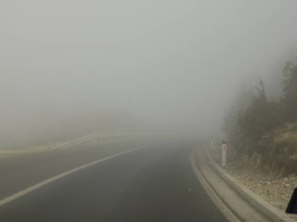 istock thick FOG on the highway 1464543805