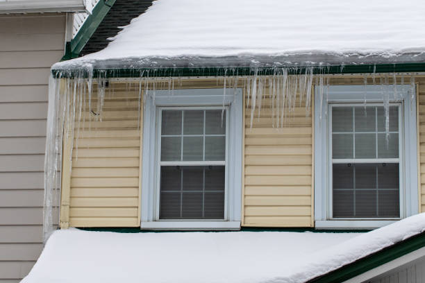 istock Icicles hanging on a house roof in winter 1464544848