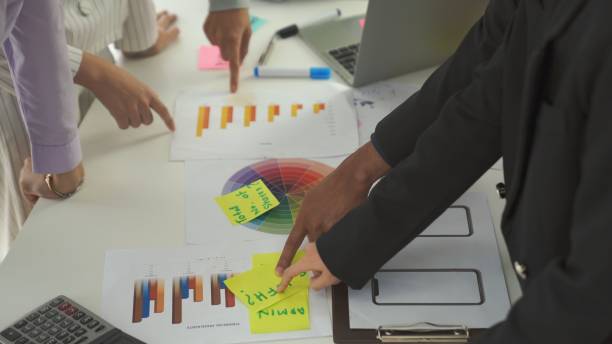 istock Business people proficiently discuss work project on meeting table . Corporate business team collaboration concept . 1464550262