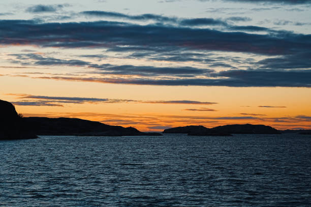Gorgeous colors behind the clouds at dusk. Calm, silence and meditation.