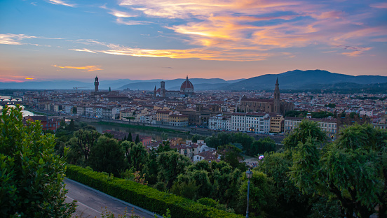 Florence Italy at sunset with a canal in the foreground