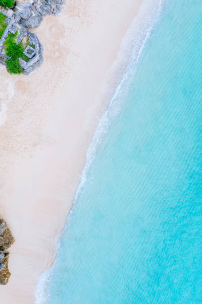 istock Beach scene from above - turquoise ocean and a sandy beach. 1464559549