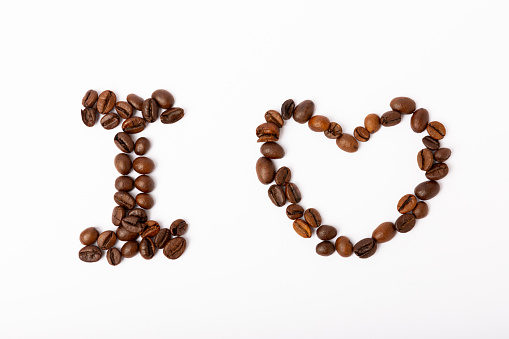 Coffee beans isolated on white background. The inscription I LOVE COFFEE from coffee beans.