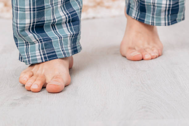 istock bare feet walking on the floor at home 1464561880